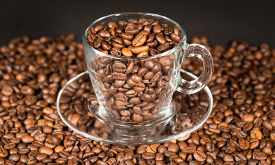 Coffe beans and beautiful cups made of glass.