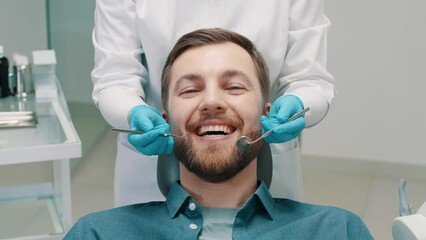 hands of a dentist girl with medical tools in dentistry