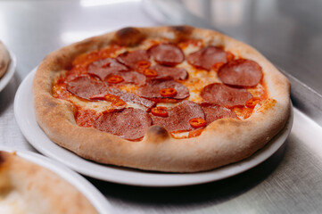pizza with sausage and pepper with tomato sauce