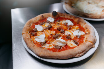pizza with minced meat and tomato sauce