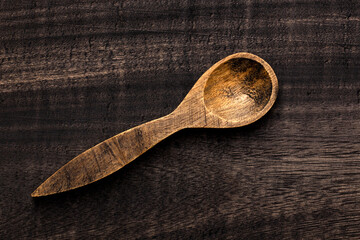 wooden spoon on dark rustic table - Kitchen accessory