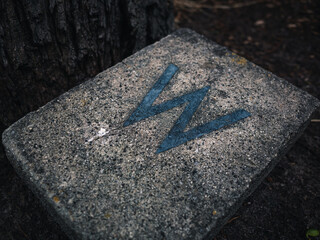 Letter w on stone surface
