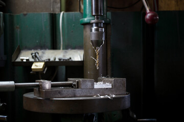 Part machining with drilling machine