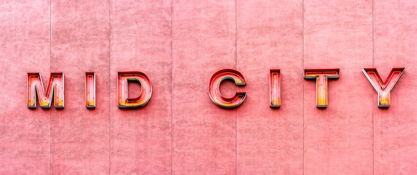 The red neon sign for the Mid City arcade and cinema on Bourke street in the city of Melbourne