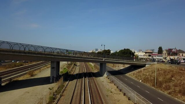Train tracks and a freeway in city