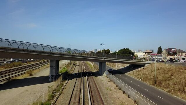 Train cruising under freeway california 
