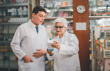 skilled pharmacist is consulting, analyzing the use of drugs to recommend and supervise patients according to prescriptions in modern pharmacies.