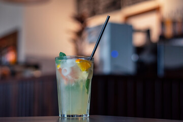 Cold drink from fresh fruits with ice in a coffee shop.
