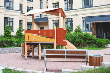 Modern european residential apartment complex yard territory, multi-story house buildings with playground and benches, contemporary scandinavian housing development, facade exterior and courtyard