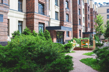 Modern european residential apartment complex yard territory, multi-story house buildings with...