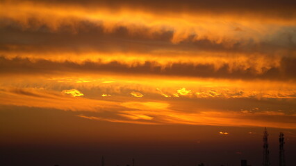 dramatic Red clouds and sunray for pattern background. A burning sky in a horror movie. crimson storm in apocalyptic, judgment day.
