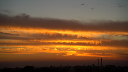 dramatic Red clouds and sunray for pattern background. A burning sky in a horror movie. crimson storm in apocalyptic, judgment day.