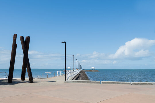 Shorncliffe Pier with wooden sculpture at entrance on beautiful sunny day