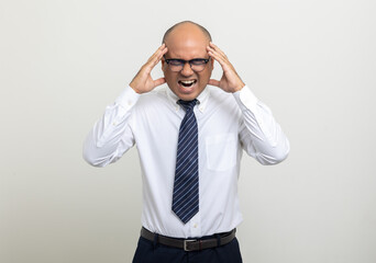 Depressed stressed. Young asian businessman on isolated white background. Angry middle aged Indian businessman in office uniform.