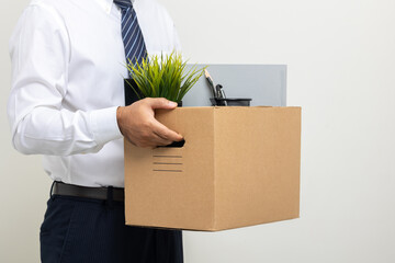 Employee first day working in the office. Happy Businessman with box cardboard personal item getting new jobs. Young man start working new office standing on isolated white background.