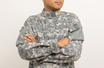 Asian man special forces soldier standing with arms crossed against on the field Mission. Commander Army soldier military defender of the nation in uniform standing on white background.