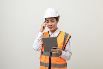 Asian engineer worker woman or architect with white safety helmet standing on isolated white background. Mechanic service factory Professional job occupation in uniform working with tablet