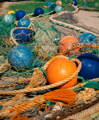 fishing nets and floats drying on the floor