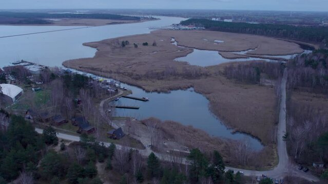 Smiala Wisla River With Boat Jetty Near Bird Reserve Ptasi Raj In Gdansk, Poland. - aerial