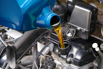 Refueling and pouring oil quality into the engine motor car Transmission and Maintenance Gear...