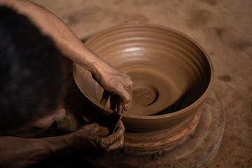 The process of forming traditional pottery crafts, located in Kasongan, Yogyakarta, Indonesia