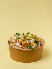 Grilled Chicken, Rice Noodles topped with Peanuts, Carrots, Beans Sprouts, Broccoli, Spring Onion, and Spicy Peanut Sauce.