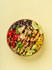 Brown Rice, BBQ Chicken, Avocado, Corn, Black beans, Tomatoes, Cilantro, Lime Wedge, Jack 'n Cheddar Cheese and BBQ Sauce.