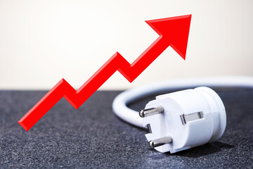  electrical plug and red arrow up, growth graph. energy saving.  rise in electricity prices concept