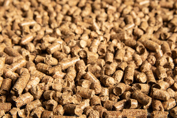 Toilets for pets, wood filler in the form of small compressed pellets background.
