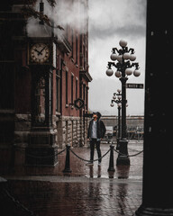 man looking at steam clock