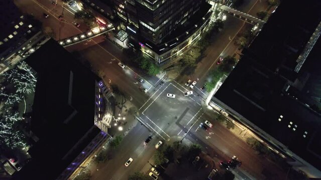 Illuminated City Intersection at Night Aerial View
