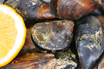 Thai mussels in metal on table top view 