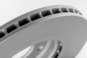 close-up brake discs on a white background, spare parts 