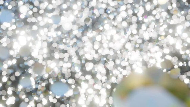 Diamond particles falling. 4K diamond dust particles falling in slow motion. Abstract diamond motion background. Thousands of diamonds shinning and sparkling as they slowly fall.