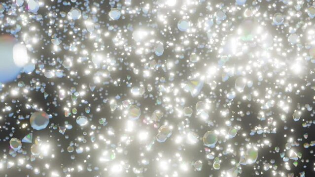 Sparkly falling diamonds. Thousands of diamonds shine and sparkle as they fall down. 4K diamond particle render. Motion background of lots of round brilliant diamonds. Magic diamond dust animation.