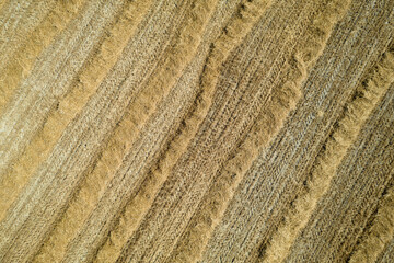 Aerial shot of a straw field left to dry