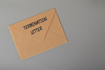 Brown envelope written with TERMINATION LETTER. Unfair dismissal concept.