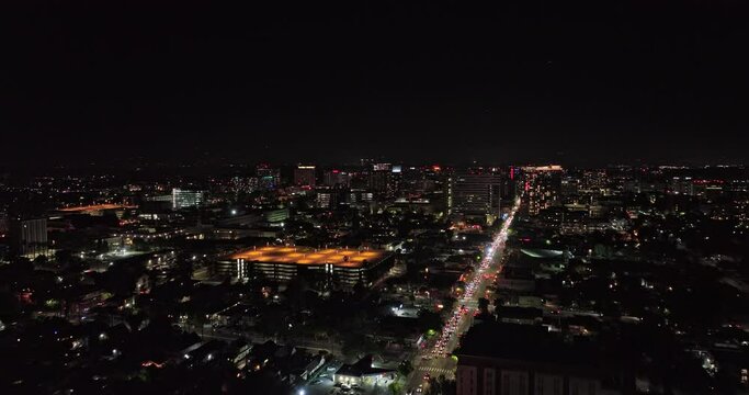 San Jose California Aerial v2 cinematic drone flyover santa clara street across the city capturing busy traffics and illuminated downtown cityscape at night - Shot with Mavic 3 Cine - June 2022