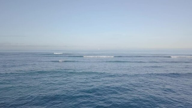 Crashing waves on the pacific ocean in waikiki beach honolulu hawaii, AERIAL DOLLY
