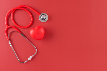Red statoscope with red heart for Valentine day, World Health Day,World Blood Donor Day and Doctor day for concept top view background.