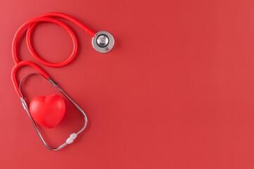 Red statoscope with red heart for Valentine day, World Health Day,World Blood Donor Day and Doctor day for concept top view background.