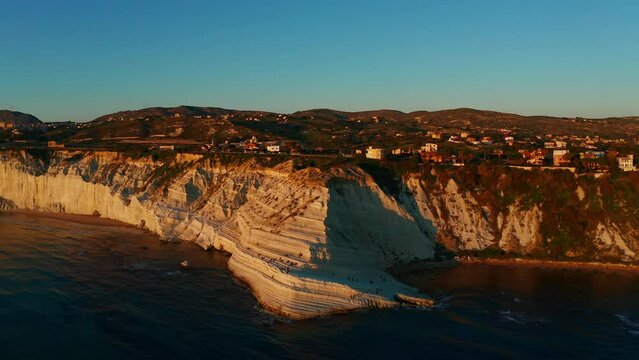 Aerial shot over a stunning cliff by the sea on the island of Sicily, Italy. Scala dei Turchi.