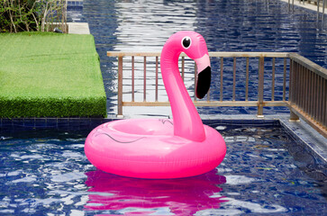 rubber inflatable circle flamingo in children's pool. swimming circle for entertainment in pool © Ninaveter