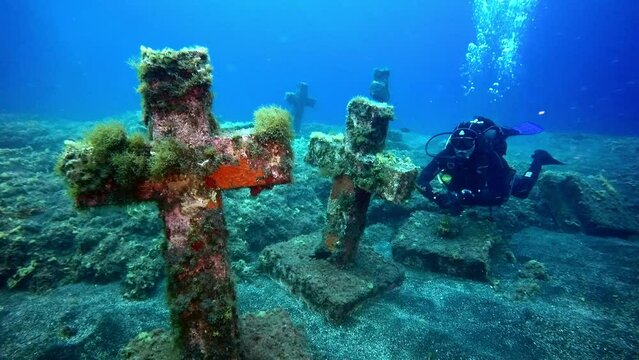 La Palma, Canary Islands - 12 May 2016: Divers near on sunken cemetery on bottom of volcanic origin in Atlantic ocean. Incredible rare footage.