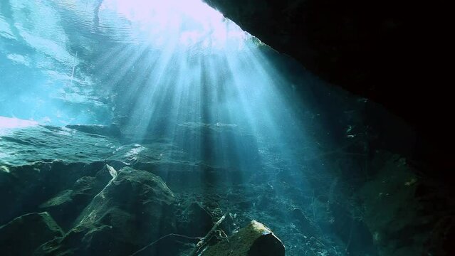 Underwater stalactites and stalagmites in landscape Mexican Sacred Mayan Cenote. Deep underground clean and clear fresh lake in cave. Unique shooting Wonders of Yucatan Peninsula nature in Dos Ojos.