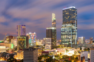 Fototapeta na wymiar Elevated view of high rise city buildings lit up on twilight at Ho Chi Minh in Vietnam