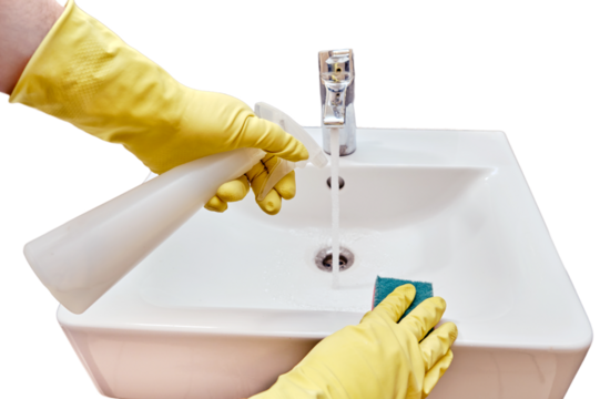 Cleaning in the public toilet of the cafe, man hand in yellow gloves wipes the sink with a sponge, isolated on a white background