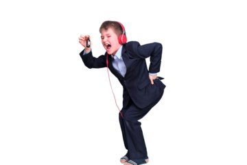 A boy in a school suit with headphones on distance learning, isolated on a white background