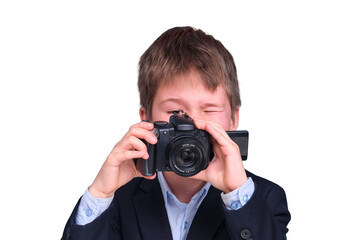 A boy in a school suit writes with a camera during distance learning, isolated on a white background