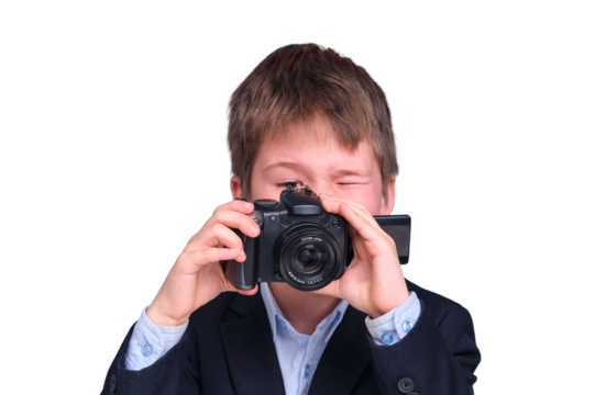A boy in a school suit writes with a camera during distance learning, isolated on a white background